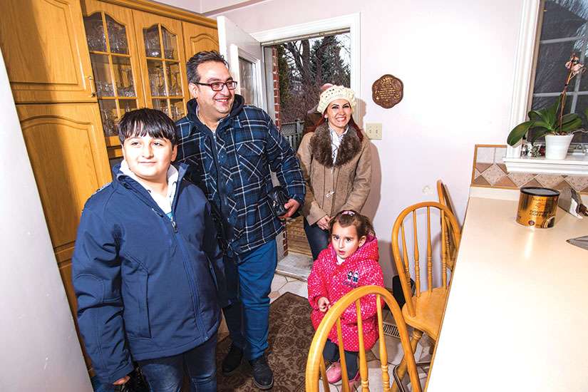 This refugee family from Aleppo, Syria, which did not wish to have its name published, is among the 25,000 refugees welcomed to Canada. As Catholics, we welcome the stranger, says Bishop Douglas Crosby.