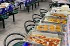 Food is laid out for the Super Bowl community dinner for homeless men in Toronto, Feb 12, 2023.