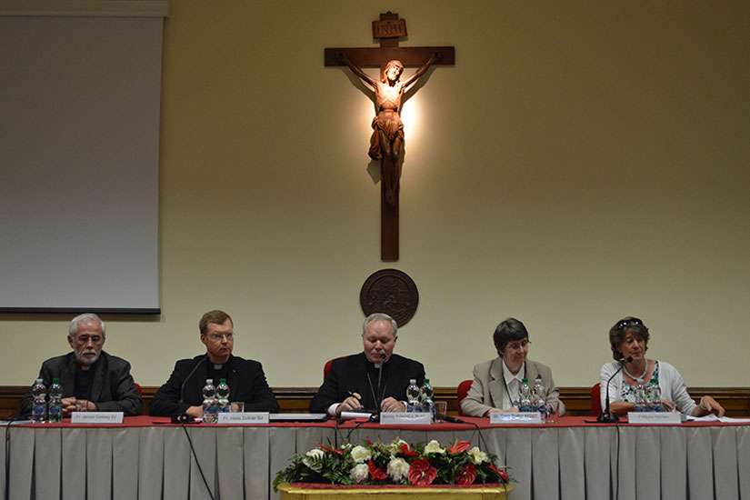 The Fr. James Corkery, theology professor at the Pontifical Gregorian University; the Fr. Hans Zollner, president of the Pontifical Gregorian University’s Centre for Child Protection; Bishop Edward J. Burns, chairman of the U.S. Conference of Catholic Bishops’ committee on child protection; Sr. Sara Butler, president of the Academy of Catholic Theology; and Philippa Hitchen, journalist at Vatican Radio, speak to the press during a conference on how to handle the current clergy sex abuse crisis.