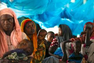 Somali refugees sit inside a tent in 2011 at the Ifo Extension refugee camp in Dadaab, Kenya, across the border from Somalia. Jesuit Refugee Service has urged Kenya to reconsider its plans to close camps that host hundreds of thousands of Somali and South Sudanese refugees.