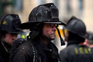 Firefighters respond to an apartment building fire in the Bronx borough of New York City Jan. 9, 2022. Pope Francis sent his condolences to families of the people killed in the fire.