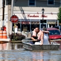 Residents use a boat to examine flooding in the town of Totowa, N.J., Aug. 30. New Jersey and Vermont continue to struggle with their worst flooding in decades, days after Hurricane Irene slammed the U.S. Northeast with torrential rain, dragging away homes and submerging neighborhoods.