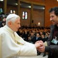 An inmate greets Pope Benedict XVI during his pastoral visit to Rebibbia prison in Rome Dec. 18.