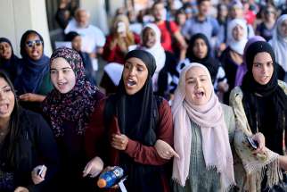 Students chant while marching at a rally against Islamophobia at San Diego State University in San Diego, Calif., on November 23, 2015.