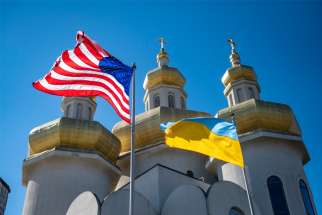 U.S. and Ukrainian national flags fly in solidarity outside St. Michael the Archangel Ukrainian Catholic Church in Baltimore Feb. 27, 2022.