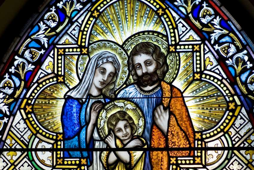 A stained glass image inside Sacred Heart Church in Sherwood, Wis., depicts the Holy Family. The feast of the Holy Family of Jesus, Mary and Joseph is celebrated this year on Dec. 31.