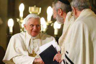  Pope Benedict XVI greets Rabbi Riccardo Di Segni, the chief rabbi of Rome, during his visit to the main synagogue in Rome in this 2010 file photo. The now retired pontiff sent a letter correcting a German theologian who implied that Pope Benedict encouraged the evangelization of the Jewish people as a mission. 