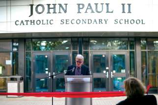 John Paul II Secondary School principal Peter Cassidy delivers remarks at the ribbon-cutting of the new carbon-neutral school in London, Ont.