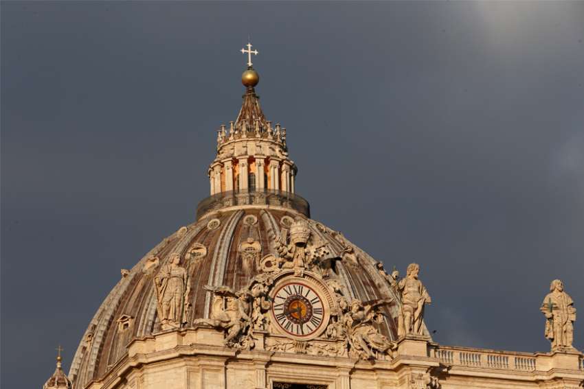 The dome of St. Peter&#039;s Basilica is pictured through the colonnade at the Vatican Jan. 26, 2022. The Vatican has released a budget project that foresees a deficit of $37.1 million in 2022.