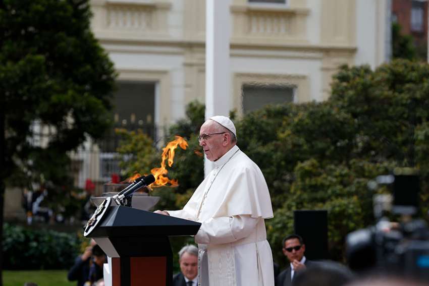 Pope Francis addresses the audience during a meeting with Colombian President Juan Manuel Santos and other government authorities in the courtyard of the presidential palace in Bogota, Colombia, Sept. 7. 