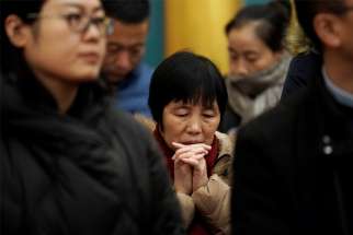 Chinese Catholics pray during Christmas Eve Mass at the Church of St. Saviour in Beijing.