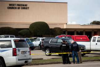 Police and fire department officials in White Settlement, Texas, surround West Freeway Church of Christ Dec. 29, 2019. A gunman killed two parishioners there that same day.