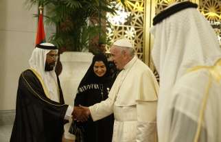 Pope Francis greets Sheikh Tahnoun bin Mohammed Al Nahyan, Abu Dhabi representative in the eastern region, upon his arrival at Abu Dhabi Presidential Flight airport in United Arab Emirates Feb. 3.