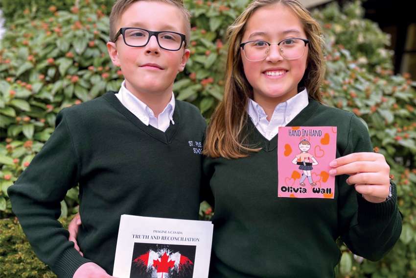 St. Pius X Grade 5 students Maksimas Viskotas and Olivia Wall, winners of the Imagine a Canada peace and reconciliation contest.