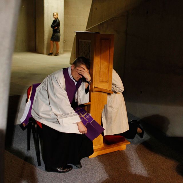 A priest listens to a confession during Mass in 2012 at the Temple of Divine Providence in Warsaw, Poland. Archbishop Rino Fisichella, president of the Pontifical Council for Promoting New Evangelization, said he repeatedly hears that &quot;many people have b een going to confession and many have said that, while they hadn&#039;t gone in a long time, they felt touched by the words of Pope Francis.&quot;