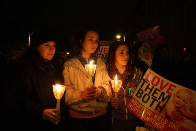 Young women hold candles as the gather for a pro-life vigil outside the Irish parliament in Dublin Jan. 19, 2013. An estimated 15,000 members of the Pro-Life Campaign came to Dublin May 3 to participate in the National Vigil for Life to work for the repeal of a controversial abortion law introduced in 2013.