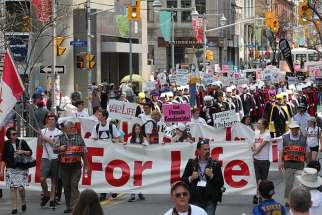 Pro-lifers march along downtown Ottawa streets in 2016. 