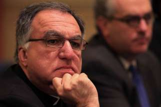 Basilian Father Thomas Rosica, CEO of Canada&#039;s Salt and Light Media Foundation, listens to a speaker Nov. 10 during the annual fall general assembly of the U.S. Conference of Catholic Bishops in Baltimore.