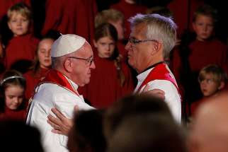 Pope Francis embraces the Rev. Martin Junge, general secretary of the Lutheran World Federation, during an ecumenical prayer service at the Lutheran cathedral in Lund, Sweden, Oct. 31, 2016.