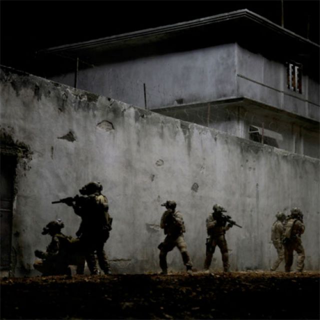 U.S. Navy SEALs are portrayed in a scene from the movie &quot;Zero Dark Thirty.&quot; The Catholic News Service classification is L -- limited adult audience, films whose problematic content many adults would find troubling. The Motion Picture Association of Ameri ca rating is R --restricted. Under 17 requires accompanying parent or adult guardian.