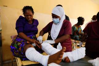 A nurse attends one of the victims of the attack by gunmen during Pentecost Mass at St. Francis Xavier Church in Owo, at the Federal Medical Centre in Owo, Ondo, Nigeria, June 6, 2022. Reports said at least 50 people were killed in the attack.