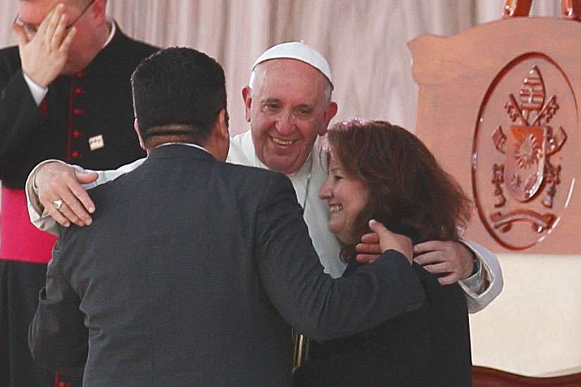 Pope Francis embraces Humberto and Claudia Gomez, who are married civilly but not in the church, during a meeting with families at the Victor Manuel Reyna Stadium in Tuxtla Gutierrez, Mexico, Feb. 15. Pope Francis&#039; postsynodal apostolic exhortation on the family, &quot;Amoris Laetitia&quot; (&quot;The Joy of Love&quot;), was to be released April 8. The exhortation is the concluding document of the 2014 and 2015 synods of bishops on the family.