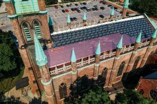 New copper shingles are being installed at Our Lady of Assumption Church, part of the first phase of renovations in the 177-year-old church in Windsor, Ont.
