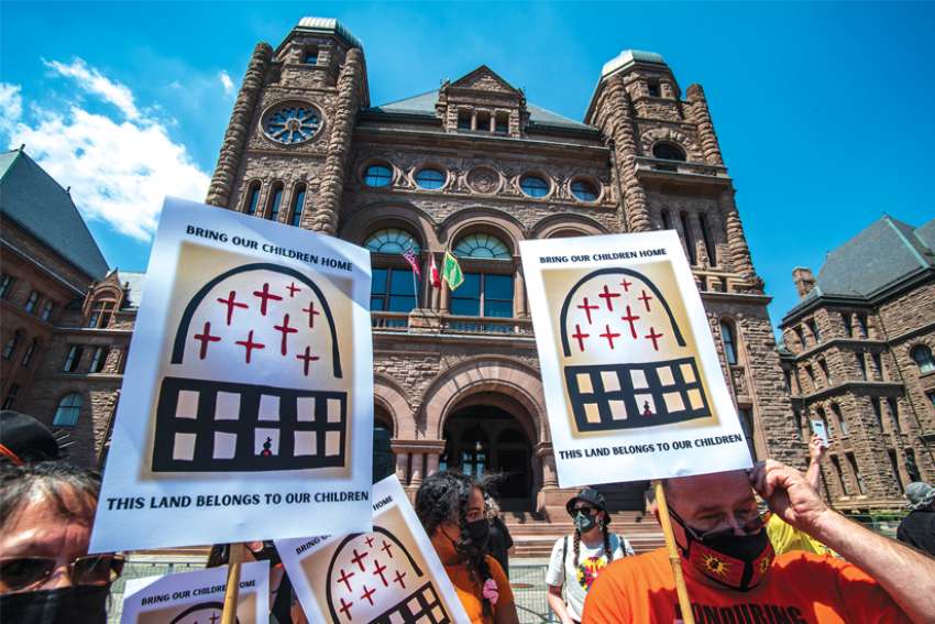 Protesters gather outside the Ontario Legislature following the discovery of unmarked graves across the nation this past summer. Pope Francis is expected to soon come to Canada to apologize for past wrongs done by the Church and its entities at residential schools.
