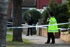 Police officers guard the site where Sir David Amess, a member of the governing Conservative Party, was stabbed while meeting constituents in Leigh-on-Sea, England, Oct. 15, 2021. Amess was one of the most prominent Catholic politicians in the U.K. Parliament.