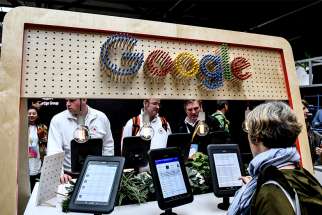 Visitors look at the digital media offerings at the booth of technology giant Google at the Republica 17 digital conference May 8, 2017, in Berlin. In an age when technology is ever-evolving, Catholic news organizations must be willing to adapt to effectively proclaim the Gospel to all, Pope Francis said. 