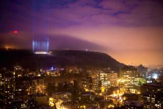 Fourteen light beams representing the 14 victims of the École Polytechnique massacre shine at Montreal’s Mount Royal on the 25th anniversary of the slayings in 2014.
