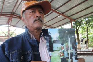 Margarito Ramirez shows a picture of his 20-year-old son, Carlos Ivan Ramirez Villarreal, Oct. 8, who was among the 43 students missing in Mexico&#039;s Guerrero state. The Sept. 26 disappearance of so many students in Guerrero states has sparked internationa l outrage and soul searching among many Mexicans.