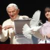 Pope Benedict XVI releases a dove from the window of his apartment overlooking St. Peter&#039;s Square after praying the Angelus at the Vatican Jan. 27. Two children representing Catholic Action Rome helped the pope observe the annual tradition of releasing d oves as a symbol of peace.