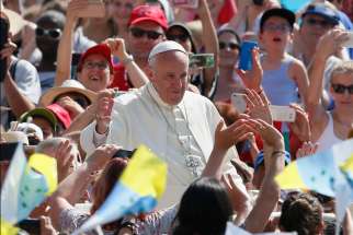 Pope Francis greets the crowd during a jubilee audience in St. Peter&#039;s Square at the Vatican June 30. The Pope is asking World Youth Day pilgrims to accompany his visit with prayer.