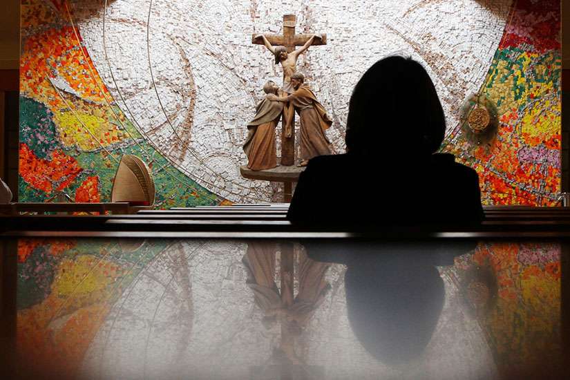 A visitor prays during Mass at a Roman Catholic Church in the village of Knock in County Mayo, in this photo taken on May 29, 2010. 
