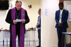 Archbishop J. Michael Miller brings prayers to the Catholic Charities Men’s Hostel just before Christmas. “It’s really a beautify ministry that you are carrying out,” he told shelter workers. The 108 beds at the shelter are filled every night of the year.
