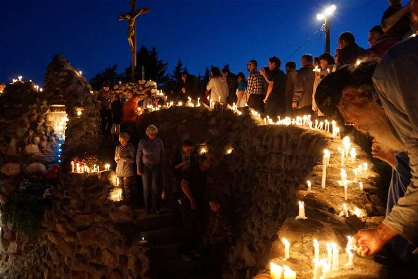 Worshippers attend a candlelight procession in 2016 at the annual Skaro Pilgrimage in Alberta. The shrine was built in 1919 by Polish pioneers who hauled 600 wagonloads of stones to the site.
