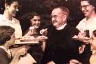 The St. Andrew’s CWL council hosts a garden party in 1953 with Fr. James Kirby.