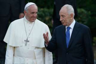 Pope Francis and former Israeli President Shimon Peres arrive for an invocation for peace in 2014 at the Vatican Gardens. Peres, who dedicated himself to the work of achieving peace during the last years of his life, died Sept. 28 at age 93.