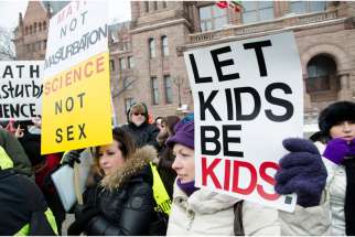 Parents rally outside Queen’s Park following the release of Ontario’s sex-ed curriculum. Some parents plan to take their kids out of school May 4-8 in protest of the curriculum.