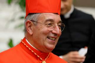 Cardinal Angelo De Donatis, papal vicar of Rome, smiles during a reception after a consistory at the Vatican in this 2018 file photo. Cardinal De Donatis was hospitalized March 30, 2020, after testing positive for the COVID-19 virus, the diocese announced.