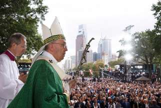 Pope Francis arrives to the altar to celebrate the closing Mass of the World Meeting of Families in Philadelphia Sept. 27, 2015. 