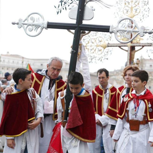 A boy carries a large crucifix as his confraternity arrives for a Mass with Pope Francis in St. Peter&#039;s Square at the Vatican May 5. The pope praised confraternities as a means of transmitting and cultivating the faith but said popular piety must be prac ticed in communion with the pastors of the church.