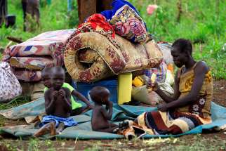 A family from South Sudan eats at a camp for displaced people in Lamwo, Uganda. As civilians are increasingly targeted in South Sudan&#039;s civil war, a bishop urged prominent community leaders speak out. (