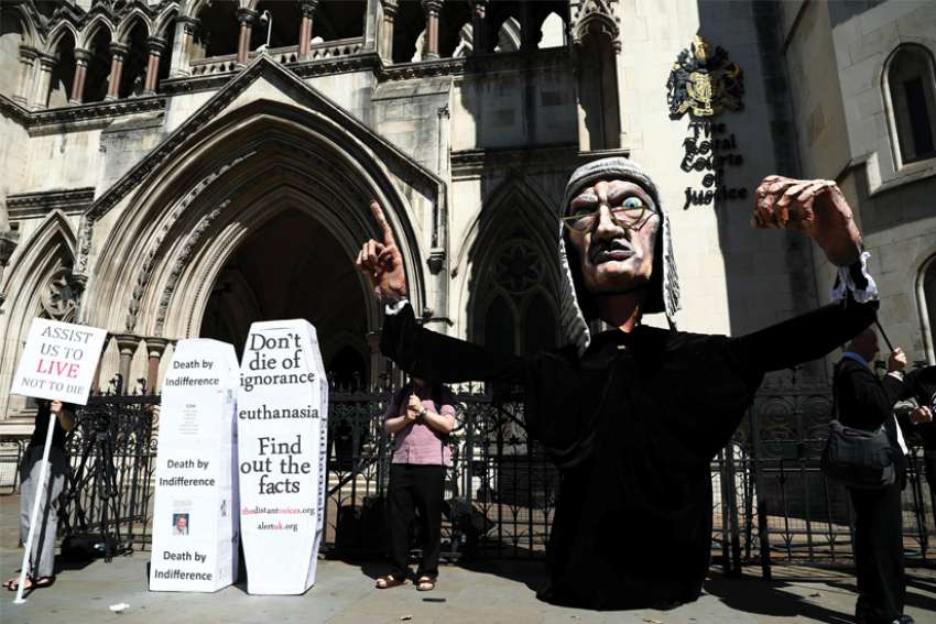 Anti-euthanasia protesters demonstrate outside the Royal Courts of Justice in London July 17, 2017. In a Sept. 7 Zoom conference, Canadian, U.S. and Belgian doctors urged British politicians to reject a new bill to legalize assisted suicide.
