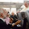 Pope Francis listens to a question from a journalist on his flight heading back to Rome July 28. The pope answered questions from 21 journalists over a period of 80 minutes on his return from Brazil.