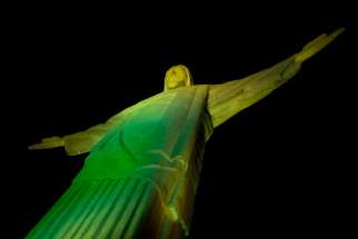 Rio&#039;s Christ the Redeemer Statue glows green to help kickoff the 2014 FIFA World Cup.