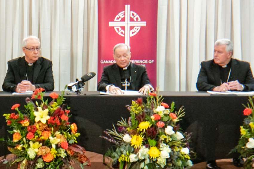 From left, Edmonton archbishop Richard Smith, CCCB president Bishop Raymond Poisson, and Calgary bishop William McGrattan, give statements and answer questions at a press conference September 29, 2022, at the conclusion to the CCCB plenary meeting.