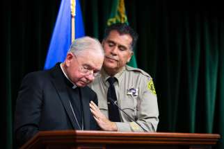 Los Angeles County Sheriff Robert Luna comforts Los Angeles Archbishop José H. Gomez while he speaks during a Feb. 20, 2023, news conference after the arrest of 65-year-old Carlos Medina, the suspect in the murder of Auxiliary Bishop David G. O&#039;Connell. Bishop O&#039;Connell was found dead of a single gunshot wound Feb. 18 at his home in Hacienda Heights, a neighbourhood east of Los Angeles.