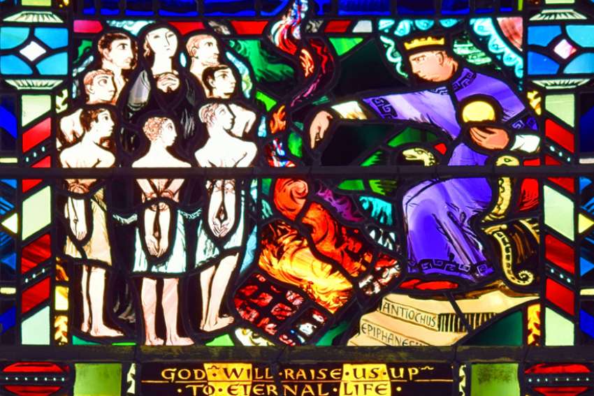 The Martyrdom of the Maccabees stained glass window from St. Etheldreda&#039;s Catholic Church, London, UK.